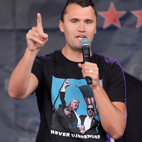 Conservative activist Charlie Kirk, wearing a shirt depicting Republican presidential nominee Donald Trump reacting defiantly after his attempted assassination, addresses supporters in Milwaukee, Wisconsin, on July 17, 2024.