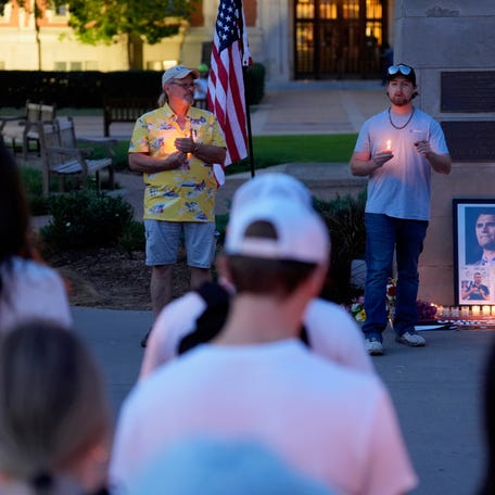 People gather for a vigil in honor of Charlie Kirk following his death on Wednesday, Sep. 10, 2025 at the University of Oklahoma in Norman, Oklahoma. Kirk, founder of Turning Point USA, was killed by a gunshot wound to the neck while speaking at Utah Valley University.