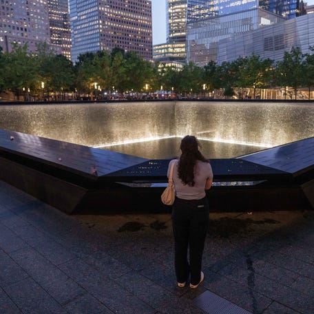 A person looks at the south reflecting pool before the annual 9/11 Commemoration Ceremony at the National 9/11 Memorial and Museum on September 11, 2025 in New York City. Government officials joined family, friends, and first responders as they gathered at Ground Zero honoring the lives of their loved ones on the 24th anniversary of the terror attacks of September 11, 2001, at the World Trade Center.