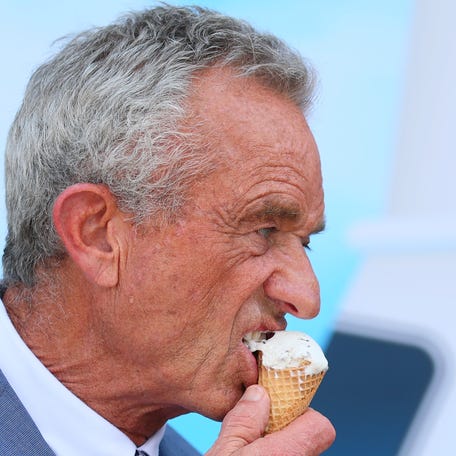 Health and Human Services Secretary Robert F. Kennedy Jr. eats a mint chocolate chip ice cream cone during a press conference on the steps of the United States Department of Agriculture on July 14, 2025 in Washington, DC.