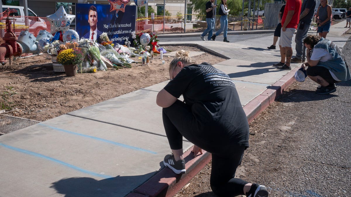 Supporters visit a memorial for Charlie Kirk at the Turning Point Headquarters in Phoenix on Sept. 11, 2025.
