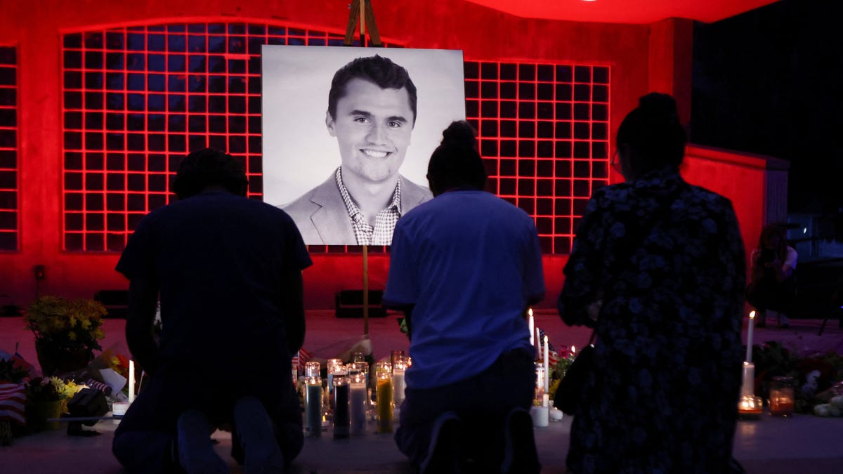 People are pictured during a vigil after Charlie Kirk was fatally shot during an event at Utah Valley University, in Orem, Utah.