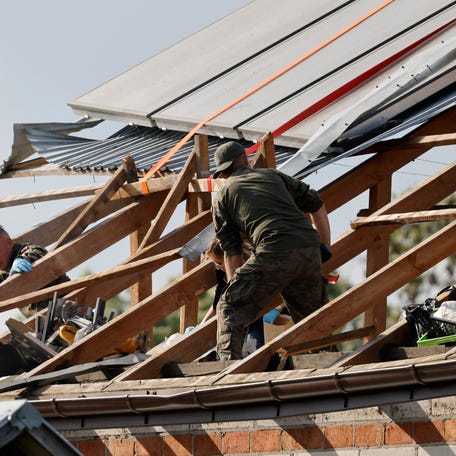 Police and army inspect damage to a house destroyed by debris from a shot down Russian drone in the village of Wyryki-Wola, eastern Poland, on September 10, 2025.