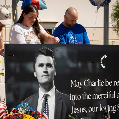 Supporters visit a memorial for Charlie Kirk at the Turning Point Headquarters in Phoenix on Sept. 11, 2025.