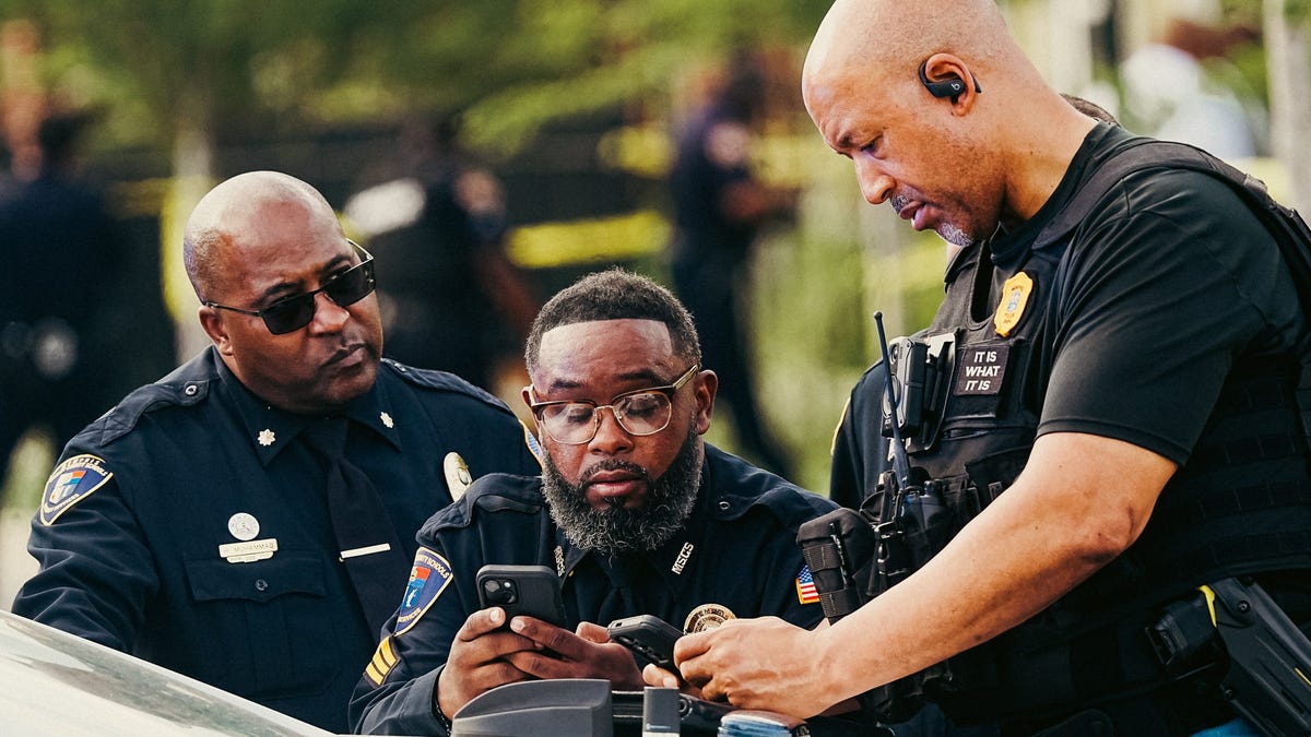 Memphis Police and other law enforcement agencies investigate the scene of a shooting resulting in the deaths of two people near Booker T. Washington High School on Thursday, April 24, 2025, in Memphis, Tenn.