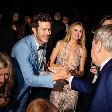 HOLLYWOOD, CALIFORNIA - SEPTEMBER 14: (L-R) Adam Brody, Justine Lupe and Ted Sarandos, CEO, Netflix attend Netflix's 2025 Emmy Celebration at NYA WEST on September 14, 2025 in Hollywood, California. (Photo by Roger Kisby/Getty Images for Netflix)