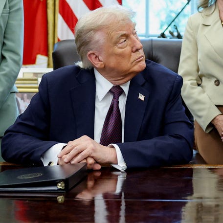 President Donald Trump, next to Tennessee Sens. Marsha Blackburn and Bill Hagerty, listens as Tennessee Gov. Bill Lee speaks during an event at the Oval Office.