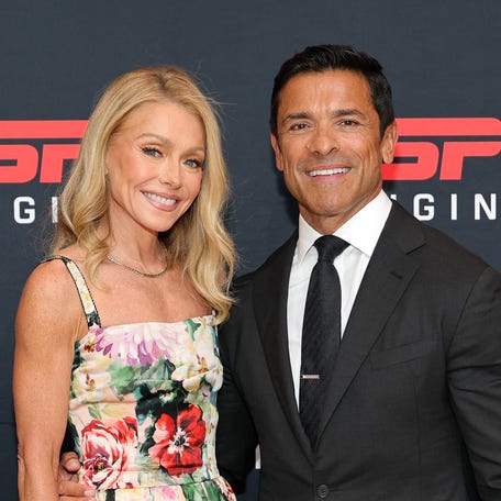 Kelly Ripa, left, and Mark Consuelos attend the "Running with the Wolves" premiere in New York City on July 23, 2025.