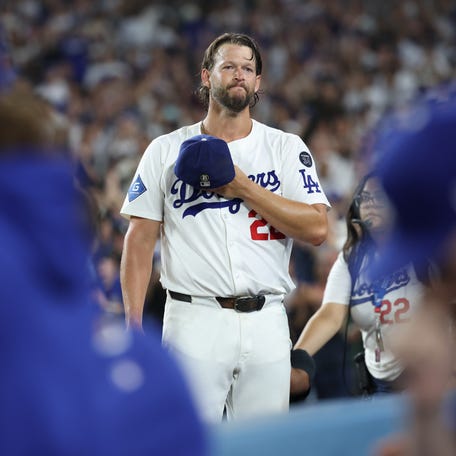Los Angeles Dodgers pitcher Clayton Kershaw (22) salutes the crowd after being relieved during the fifth inning against the San Francisco Giants.