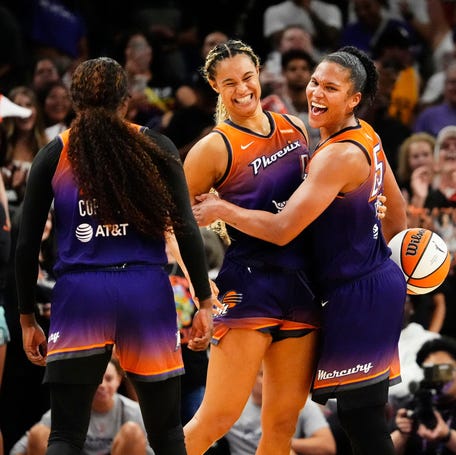 Phoenix Mercury guard Kahleah Copper (2), forward Satou Sabally (0) and forward Alyssa Thomas (25) celebrate their win over the New York Liberty.