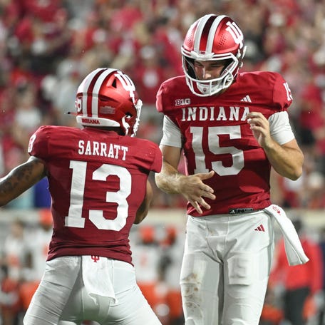 Indiana Hoosiers wide receiver Elijah Sarratt (13) and Indiana Hoosiers quarterback Fernando Mendoza (15) celebrate after a touchdown during the second half against the Illinois Fighting Illini at Memorial Stadium.