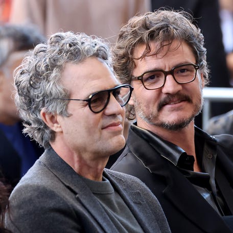 Mark Ruffalo, left, and Pedro Pascal attend the Hollywood Walk of Fame ceremony for Willem Dafoe on Jan. 8, 2024, in Hollywood.