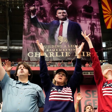 Participants worship during the memorial service honoring Charlie Kirk at State Farm Stadium in Glendale, Arizona, on Sept. 21, 2025. Charlie Kirk, the conservative activist and founder of Turning Point USA was assassinated on Sept. 10, 2025.
