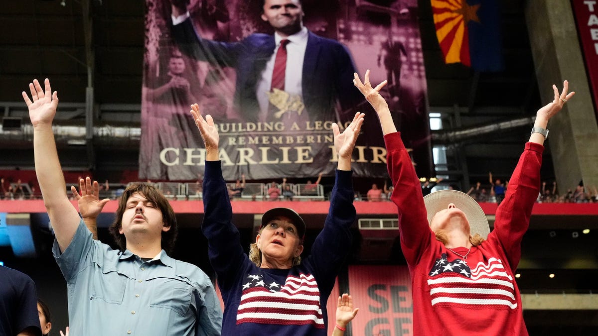 Participants worship during the memorial service honoring Charlie Kirk at State Farm Stadium in Glendale, Arizona, on Sept. 21, 2025. Charlie Kirk, the conservative activist and founder of Turning Point USA was assassinated on Sept. 10, 2025.