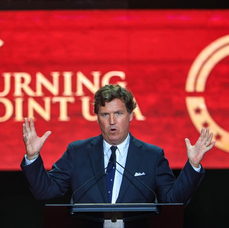Political commentator Tucker Carlson addresses a memorial service for conservative star Charlie Kirk on Sept. 21, 2025, in Glendale, Arizona.