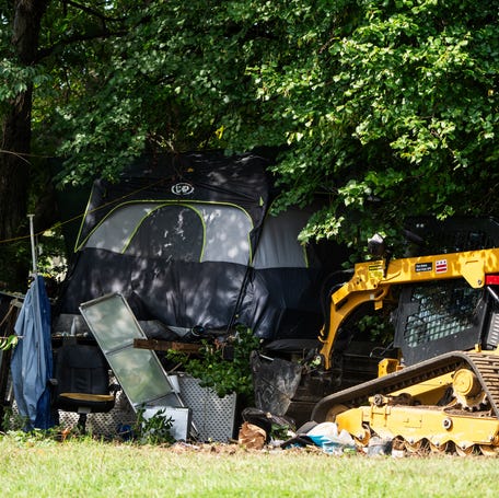 Washington, DC, crews clear a homeless encampment near the Kennedy Center on Aug. 14, 2025.