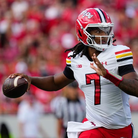Maryland Terrapins quarterback Malik Washington (7) throws a pass during the first quarter against the Wisconsin Badgers at Camp Randall Stadium.