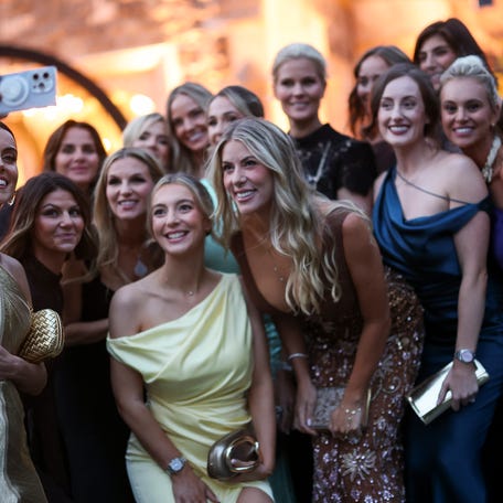 Diane Donald, wife of Captain Luke Donald of Team Europe takes a selfie with other partners of Team Europe during the Ryder Cup Teams' Welcome Dinner prior to the Ryder Cup 2025 at Hempstead House on September 23, 2025 in Sands Point, New York.