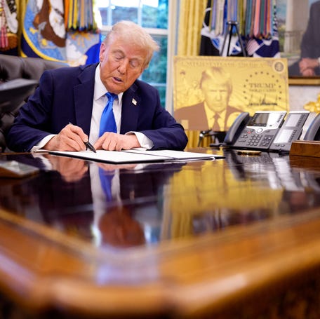 President Donald Trump signs immigration executive orders in the Oval Office at the White House on Sept. 19, 2025. One order introduced a $100,000 fee for H-1B work visas, and the other established the "Gold Card," allowing a pathway for an immigrant visa in return for a $1 million investment in the United States.