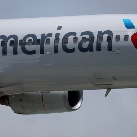 MIAMI, FLORIDA - JULY 24: An American Airlines plane lands at the Miami International Airport on July 24, 2025 in Miami, Florida.