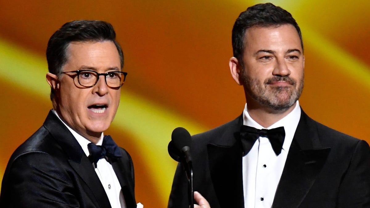 Stephen Colbert and Jimmy Kimmel present the award for lead actress in a comedy series during the 71st Emmy Awards at the Microsoft Theater on Sept. 22, 2019.