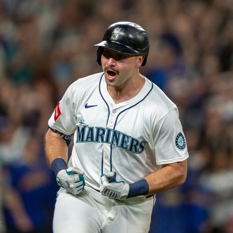 Seattle Mariners catcher Cal Raleigh celebrates after hitting a solo home run during the eighth inning against the Colorado Rockies at T-Mobile Park.