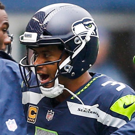 Sep 17, 2017; Seattle, WA, USA; Seattle Seahawks cornerback Richard Sherman (25) and quarterback Russell Wilson (3) celebrate during the fourth quarter two minute warning timeout against the San Francisco 49ers at CenturyLink Field. Mandatory Credit: Joe Nicholson-USA TODAY Sports