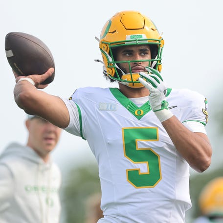 Dante Moore #5 of the Oregon Ducks warms up prior to the game against the Northwestern Wildcats at Northwestern Medicine Field at Martin Stadium on September 13, 2025 in Evanston, Illinois.