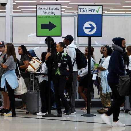 ATLANTA, GEORGIA - JUNE 28: Travelers wait in a security checkpoint line at Hartsfield-Jackson Atlanta International Airport on June 28, 2024 in Atlanta, Georgia.