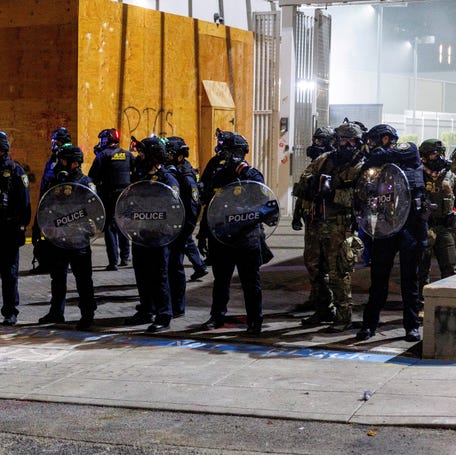 Police stand guard during a protest against the Trump administration's immigration policies outside an Immigration and Customs Enforcement detention facility in Portland, Oregon, on Sept. 1, 2025.