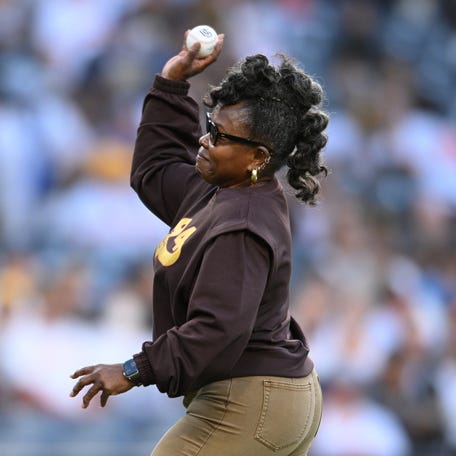 Alicia Gwynn throws out the ceremonial first pitch before a 2022 game between the Padres and Cubs.