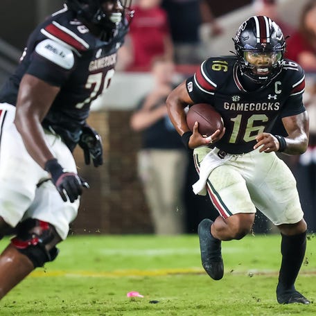 Sep 27, 2025; Columbia, South Carolina, USA; South Carolina Gamecocks quarterback LaNorris Sellers (16) scrambles against the Kentucky Wildcats in the second half at Williams-Brice Stadium.