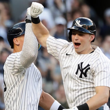 NEW YORK, NEW YORK - SEPTEMBER 28: Ben Rice #22 (R) of the New York Yankees celebrates his go-ahead solo home run with Aaron Judge #99 in the eighth inning against the Baltimore Orioles at Yankee Stadium on September 28, 2025 in New York City. (Photo by Kent J. Edwards/Getty Images)