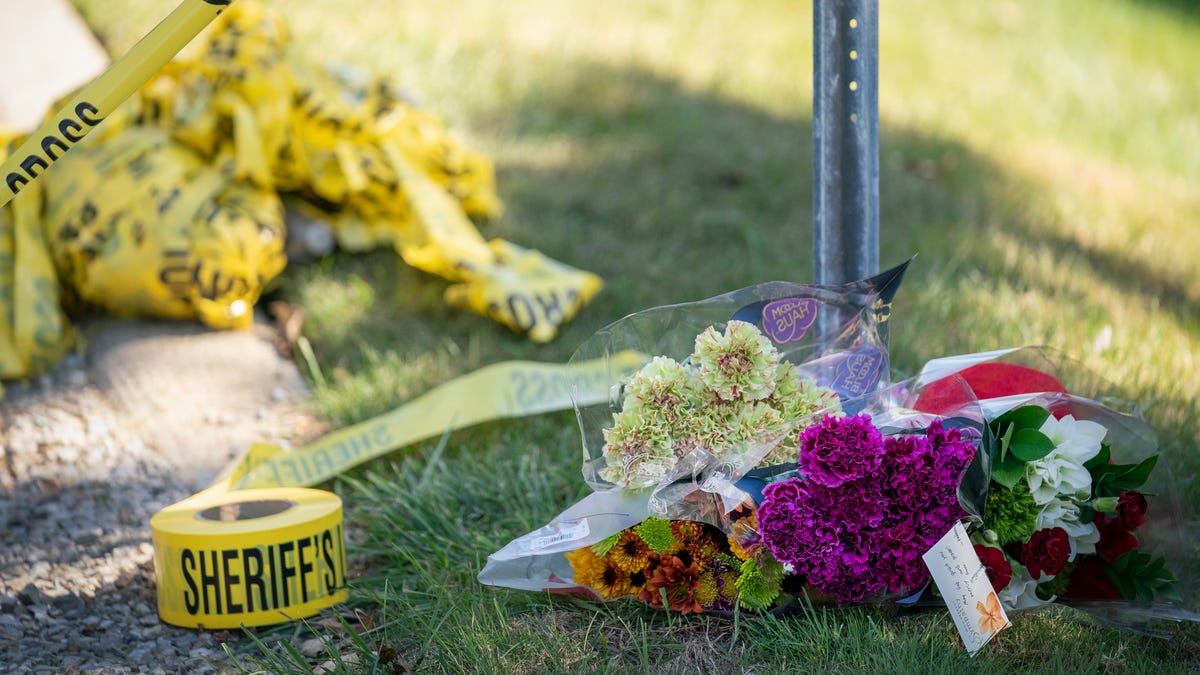 A makeshift memorial begins to grow near police tape close to the scene at The Church of Jesus Christ of Latter-day Saints in Grand Blanc Township on Monday, Sept. 29, 2025.