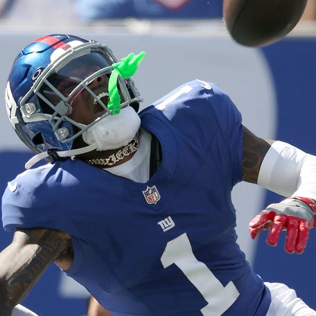 EAST RUTHERFORD, NEW JERSEY - SEPTEMBER 28: Malik Nabers #1 of the New York Giants is injured on the play against Cam Hart #20 of the Los Angeles Chargers during the second quarter in the game at MetLife Stadium on September 28, 2025 in East Rutherford, New Jersey. (Photo by Al Bello/Getty Images)