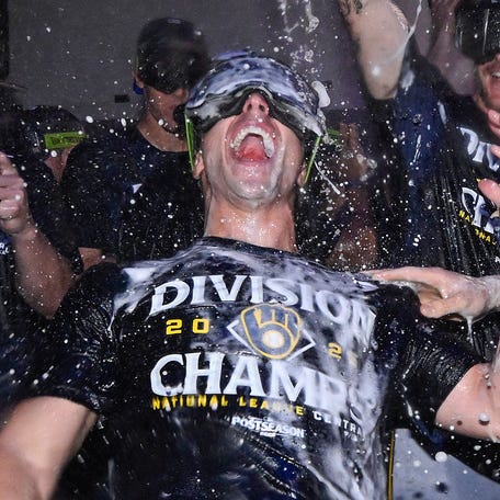 Brewers outfielder Sal Frelick gets doused celebrating the team's NL Central title.