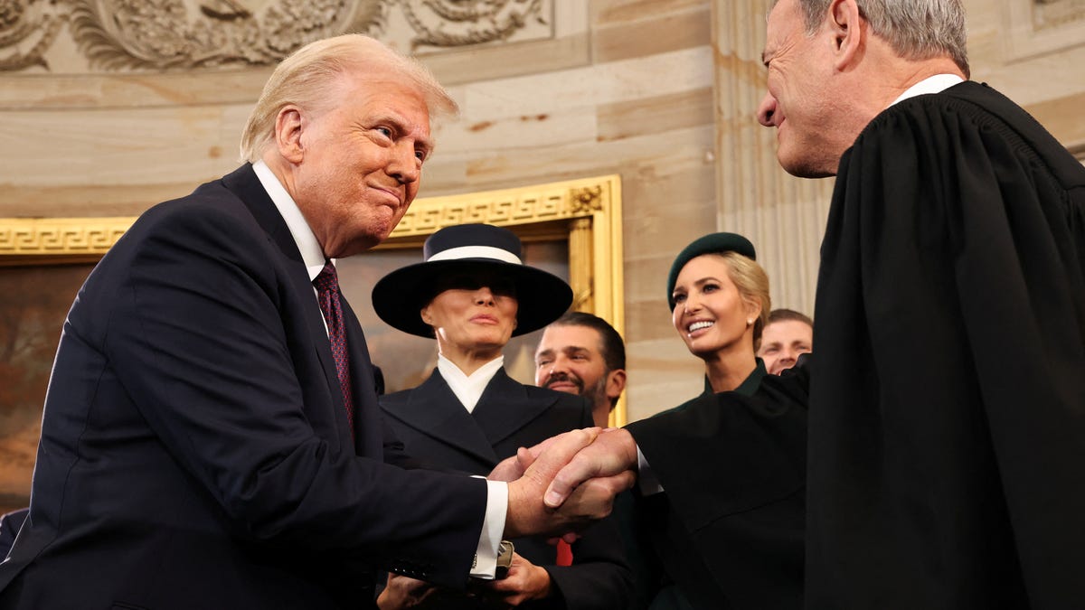 President Donald Trump shakes hands with Supreme Court Chief Justice John Roberts in the Rotunda of the U.S. Capitol on Jan. 20, 2025.
