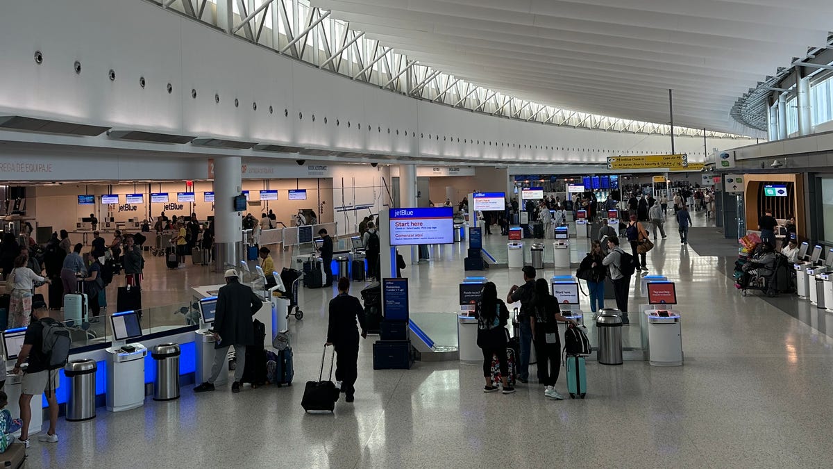 Passengers check in at the JetBlue terminal at John F. Kennedy International Airport on May 7, 2025.