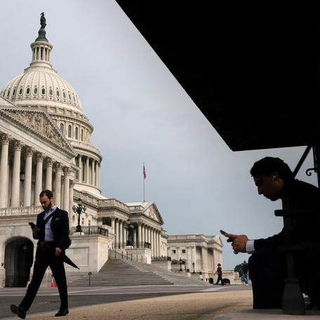 Visitors walk near the U.S. Capitol as a looming partial government shutdown is a week away if Congress fails to fund the government, on Capitol Hill in Washington, D.C., U.S., September 24, 2025. REUTERS/Nathan Howard