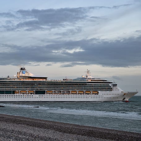 This picture taken on May 8, 2019 shows Royal Caribbean's Serenade of the Seas cruise ship leaving the harbor entrance channel of Le Havre, northern France.