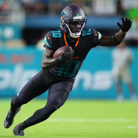 Sep 29, 2025; Miami Gardens, Florida, USA; Miami Dolphins wide receiver Tyreek Hill (10) makes a catch against the New York Jets during the first half at Hard Rock Stadium.