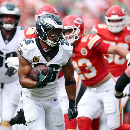 Running back Saquon Barkley #26 of the Philadelphia Eagles carries the ball during the game against the Kansas City Chiefs at Arrowhead Stadium on September 14, 2025 in Kansas City, Missouri.