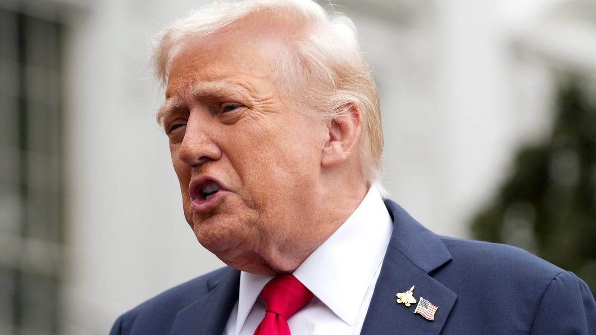 President Donald Trump speaks to reporters outside the White House on Sept. 30, 2025, before boarding Marine One to depart for Quantico, Virginia.