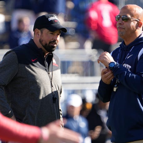 Oct 29, 2022; University Park, Pennsylvania, USA; Ohio State Buckeyes head coach Ryan Day talks to Penn State Nittany Lions head coach James Franklin prior to the NCAA Division I football game at Beaver Stadium.