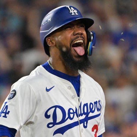 Teoscar Hernandez celebrates ater hitting a three-run homer in the third inning of Game 1.