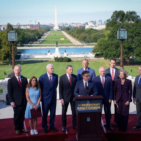 House Speaker Mike Johnson, R-Louisiana, center, and Senate Majority Leader John Thune, R-South Dakota, center back, hold a press conference with House and Senate leadership from the United States Capitol on the morning of the first day of the federal government shutdown on October 1, 2025 after President Donald Trump and congressional leaders failed to reach a funding compromise.