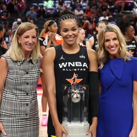 Napheesa Collier (24) celebrates an All-Star Game win with WNBA commissioner Cathy Engelbert.