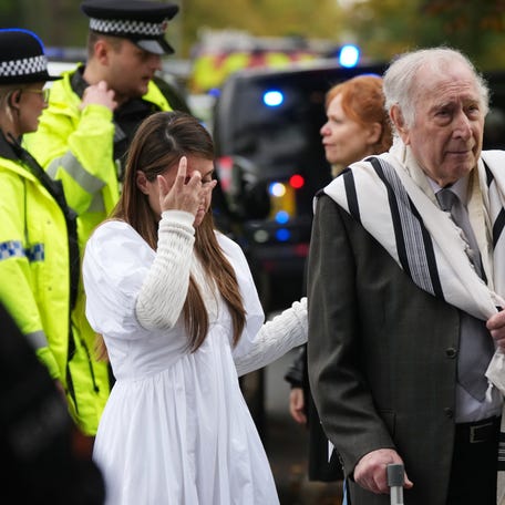 Members of the public and congregants seen as Police and other emergency responders attend the Heaton Park Hebrew Congregation Synagogue, where multiple were injured after stabbing and car attack on Yom Kippur, on October 2, 2025 in the Crumpsall suburb of Manchester, England.