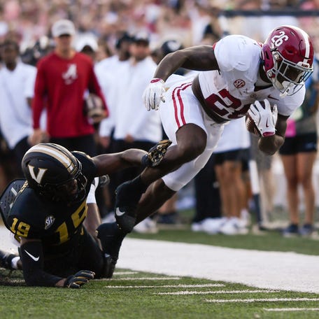 Vanderbilt quarterback Blaze Berlowitz (19) knocks Alabama running back Jam Miller (26) out of bounds just short of the goal line during the first half at FirstBank Stadium.