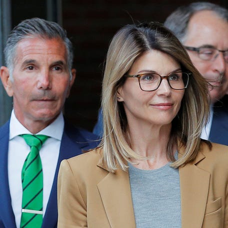 Actor Lori Loughlin, and her husband, fashion designer Mossimo Giannulli, leave the federal courthouse after facing charges in a nationwide college admissions cheating scheme, in Boston on April 3, 2019.